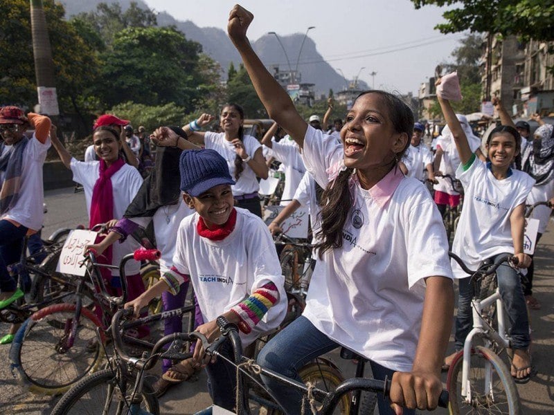 Nearly 100 women and girls rode through the busy streets of Mumbra in a bike rally for gender equality organized by Awaaz.