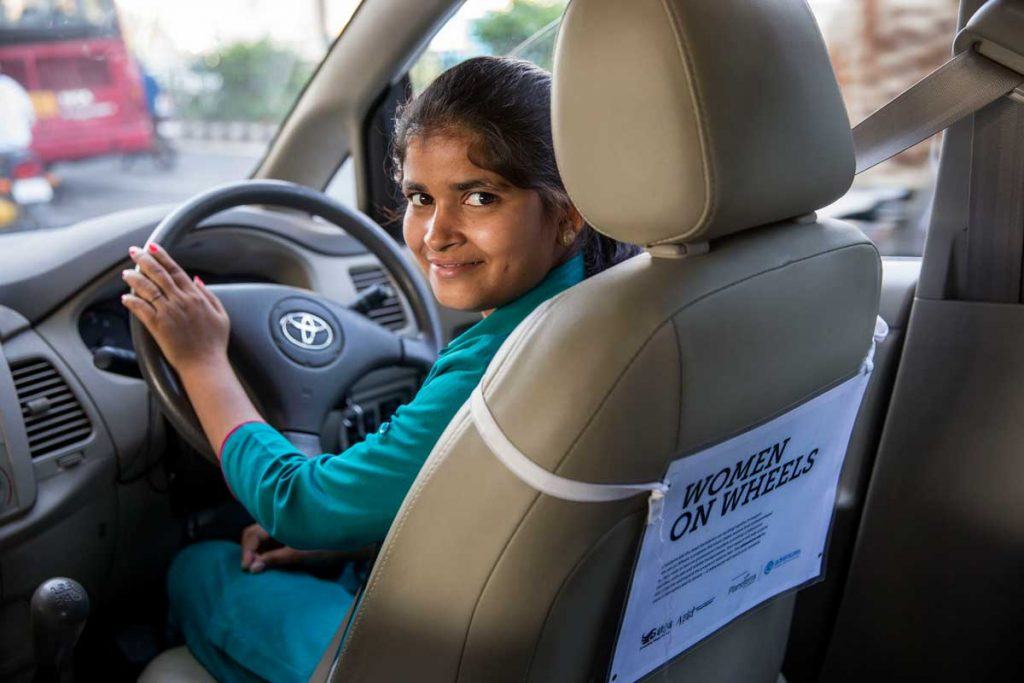 Khushi Prajapati learned how to drive a cab from Azad Foundation, an AJWS grantee that supports low-income women living in Delhi slums to pursue non-traditional careers. Note: Khushi was not a participant in the research study described in this post. Photo by Jonathan Torgovnik