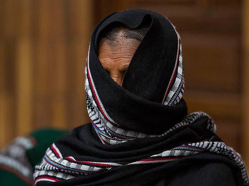 A sexual slavery survivor stands during a break in the Sepur Zarco trial in Guatemala.